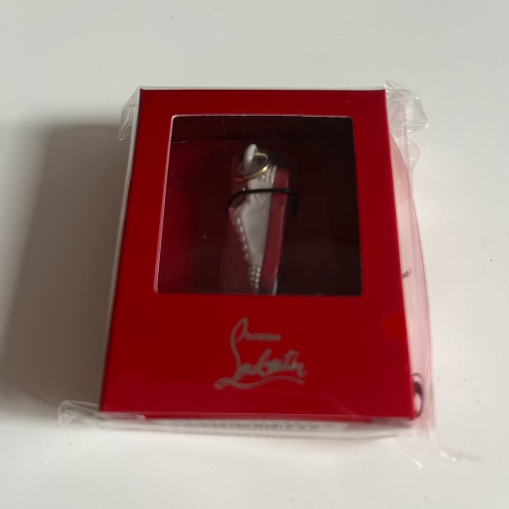 Christian Louboutin Red and white sneaker charm